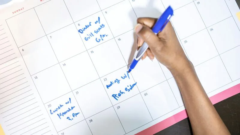 Meeting organization with calendar and laptop